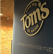 toms of maine branding solution dimensional logo on black wall